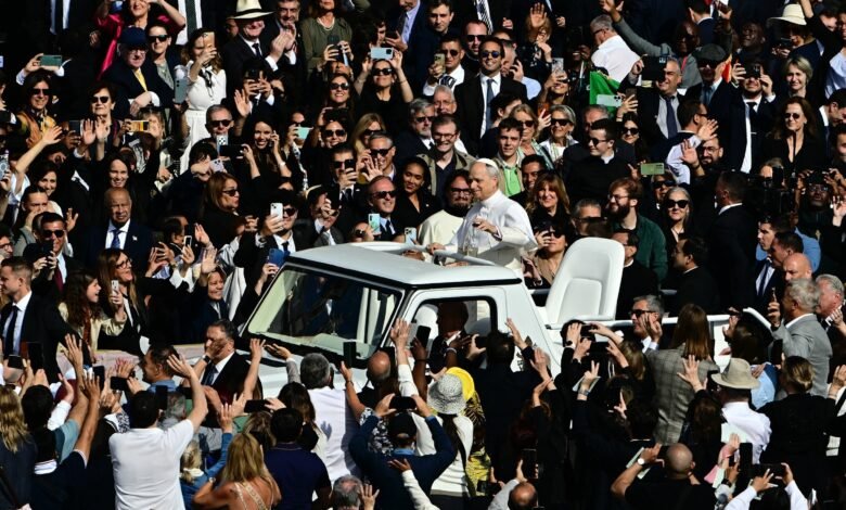 Pope Leo XIV celebrates the inaugural Mass after touring the Plaza de San Pedro in Popemobile